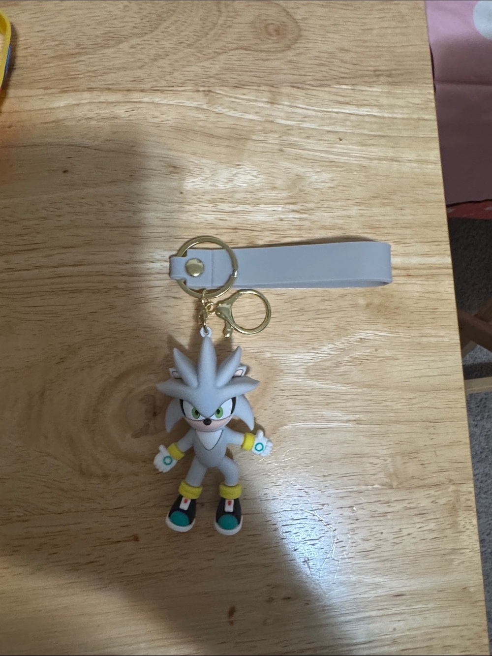 Hedgehog with a Sonic Frontiers branded strap key chain